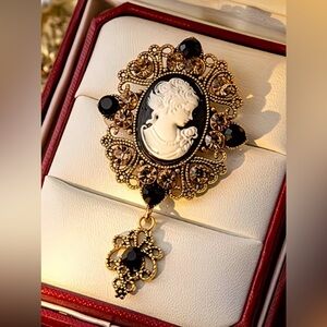 Elegant Gold and Black Cameo Brooch